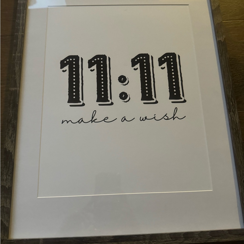 1 framed print and one hanging sign.